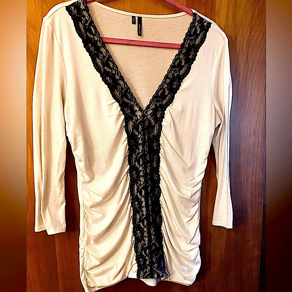 Maurices, White V neck with black lace trim on collar and front